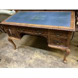 A Queen Anne Revival walnut kneehole desk, width 122cm, depth 62cm, height 75cm
