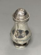 A George II silver baluster pepperette, by John Gamon, circa 1730, 10.9cm, 96 grams.CONDITION: