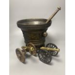 A large bronze mortar and pestle, bearing mock date 1630, 25cm diameter, and two iron and brass
