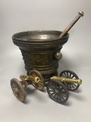 A large bronze mortar and pestle, bearing mock date 1630, 25cm diameter, and two iron and brass