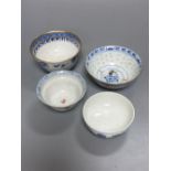 An 18th century English blue and white tea bowl and three smaller Chinese ceramic cups, two marks