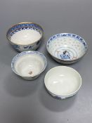 An 18th century English blue and white tea bowl and three smaller Chinese ceramic cups, two marks