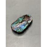 A Chinese carved Australian boulder opal pendant with flowers to the front and fruit to the back,