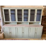 A Victorian style painted twelve door cabinet, width 304cm, depth 60cm, height 240cm