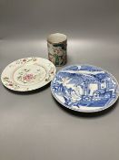 An 18th century Chinese famille rose plate together with a Chinese blue and white plate and a