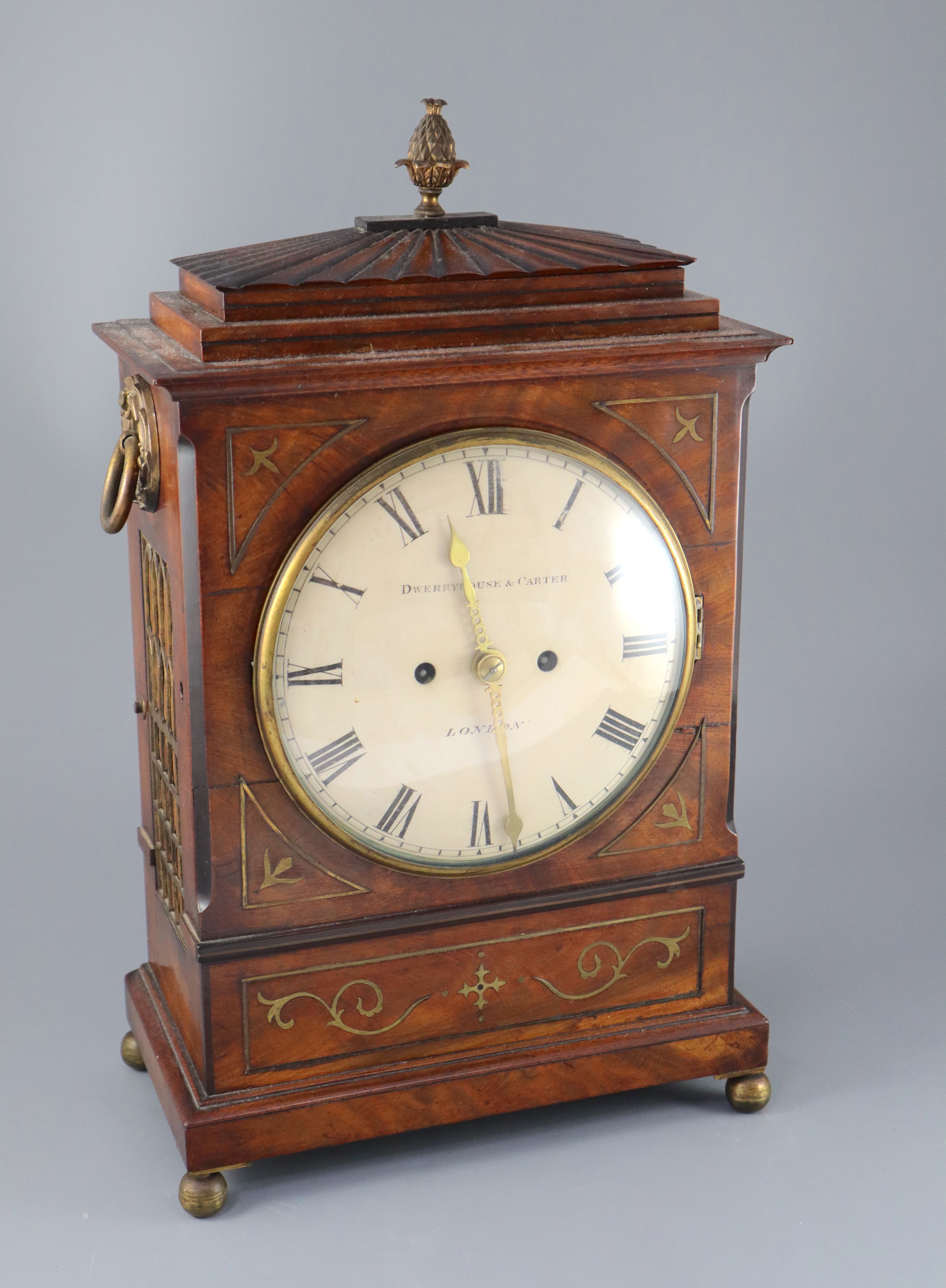 Dwerryhouse & Carter of London. A Regency brass inset mahogany mantel clock, with architectural case