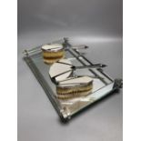 An Art Deco mirrored glass dressing table tray, 40 x 24cm and three Art Deco chrome plated