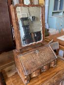 An early 18th century walnut toilet mirror, the base enclosed by fall front over drawer, width 46cm,