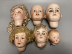 A Kammer & Reinhardt / Simon & Halbig bisque doll head, 10cm, three other German bisque doll heads
