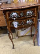 A French kingwood bird's eye maple porcelain mounted serpentine two drawer bedside cabinet, width