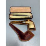 A silver-mounted Meerschaum pipe and two cut-throat razors, all cased