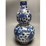 A large Chinese double gourd vase, blue and white dragon design, height 38cm