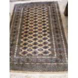 A Bokhara mustard ground rug, 185 x 131cm