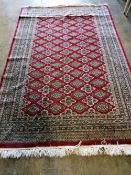 A Pakistan Persian pattern rug, red ground, 237 x 153cm