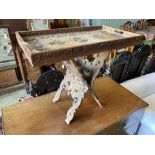 A WWI Sino-Burmese carved teak tray on folding stand, carved with the badges of the RFC, the RA