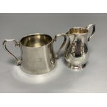 A George V Brittania standard silver 'sparrow beak' cream jug, London, 1910 and an earlier silver
