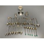A silver dwarf candlestick, two silver condiments and a group of assorted silver, white metal and