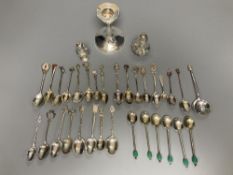 A silver dwarf candlestick, two silver condiments and a group of assorted silver, white metal and