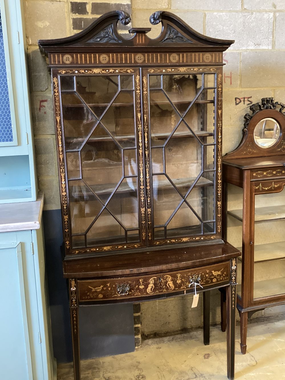 An Edwardian marquetry inlaid mahogany bow front display cabinet, width 92cm, depth 47cm, height