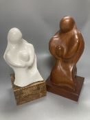 After Henry Moore, two related figural sculptures in wood and plaster, 31cm, white composition,