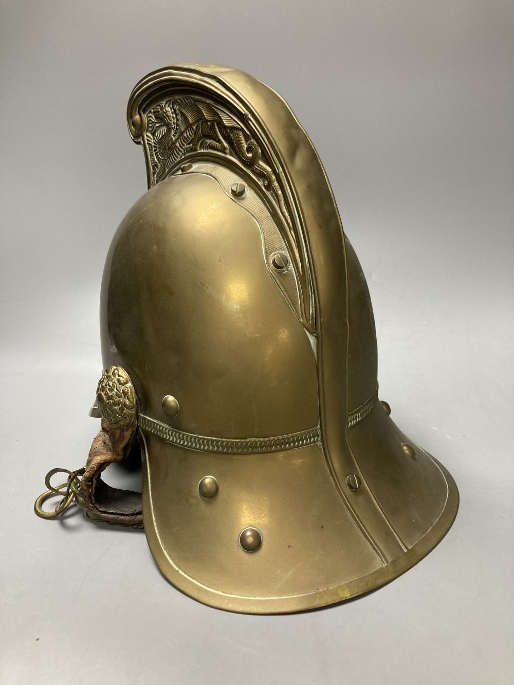 An early 20th century brass fireman's helmet, 17cm - Image 2 of 4