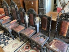 A set of six 19th century Flemish carved oak dining chairs, two with arms (fault)