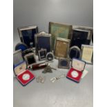 Two George V silver mounted photograph frames, largest 21cm, nine other modern silver frames, two