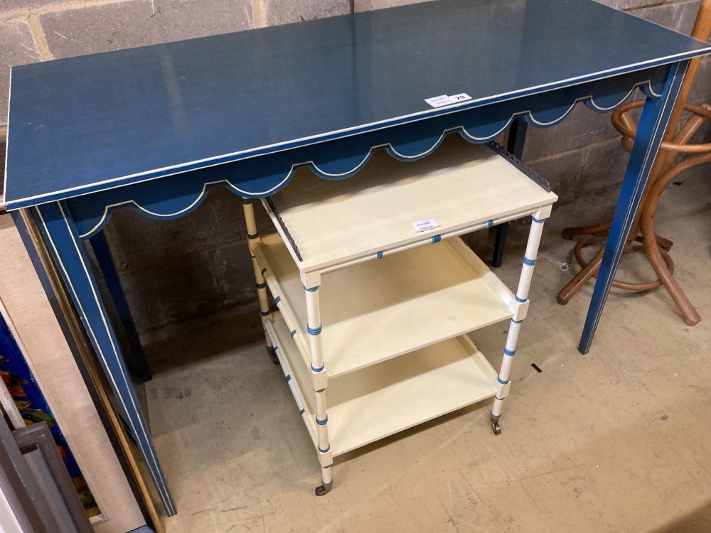 A Regency style cream painted three tier bedside table, a blue painted white lined dressing table (