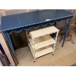 A Regency style cream painted three tier bedside table, a blue painted white lined dressing table (