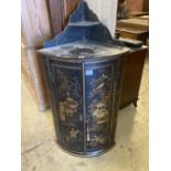 A George III black and gilt chinoiserie lacquered bow fronted hanging corner cupboard, width 60cm,
