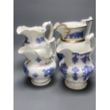 Four early 19th century Staffordshire jugs, each with lilac coloured floral applied panels, one
