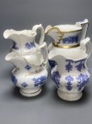 Four early 19th century Staffordshire jugs, each with lilac coloured floral applied panels, one