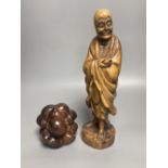 Two Oriental figural wood carvings, tallest 31cm