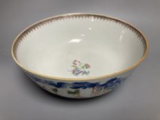 A Chinese famille rose punch bowl, Qianlong period, enamel painted in underglaze blue with famille