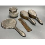 A five-piece silver-mounted dressing table set, London 1919.