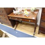 A Regency satinwood banded mahogany sofa table, with two ebony beaded drawers, on ebony strung