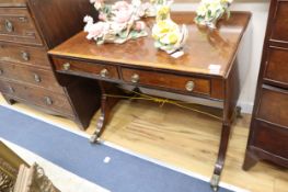 A Regency satinwood banded mahogany sofa table, with two ebony beaded drawers, on ebony strung