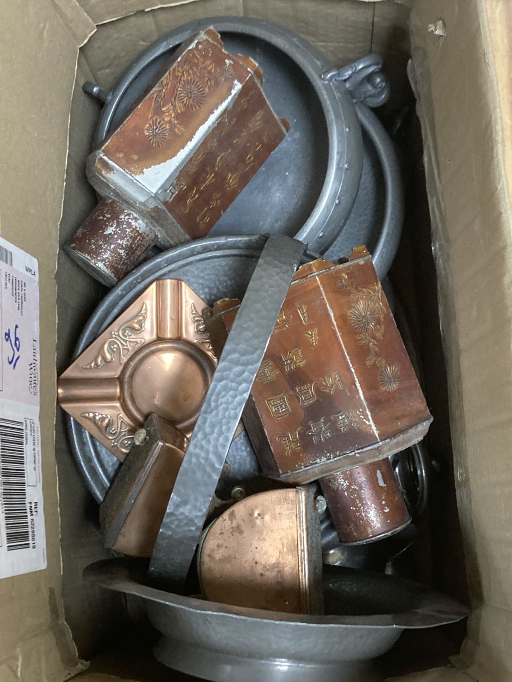 A collection of mixed hammered pewter and copper tea caddies, including two Chinese hexagonal tea