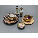 A Royal Worcester miniature cup and saucer painted with fruit, signed W. Hale, height 4cm, two scent
