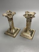 A pair of late Victorian silver dwarf candlesticks, Henry Matthews, Birmingham, 1895, 14.2cm,