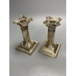 A pair of late Victorian silver dwarf candlesticks, Henry Matthews, Birmingham, 1895, 14.2cm,