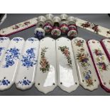 Five pairs of French porcelain door handles and ten porcelain door plates