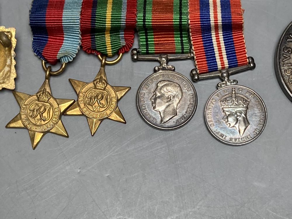 A WWII trio and a WWI pair, a collection of cap badges and non matching WWII miniatures - Image 2 of 6