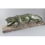 Brault. An Art Deco patinated bronze model of a prowling panther, with light green brown patination,