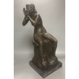 A bronze model of a seated female nude, indistinctly signed Silk, on marble plinth, 52cm