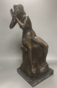 A bronze model of a seated female nude, indistinctly signed Silk, on marble plinth, 52cm