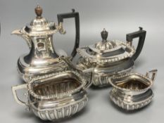 A George V demi fluted silver four piece tea set by Charles Boyton & Son Ltd, London 1918 and