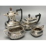 A George V demi fluted silver four piece tea set by Charles Boyton & Son Ltd, London 1918 and