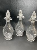 A set of three facet cut glass decanters and stoppers, early 19th century, 27.5cmCONDITION: Andrew