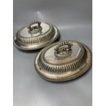 A pair of silver plated oval entree dishes, with covers and detachable handles, 29cm